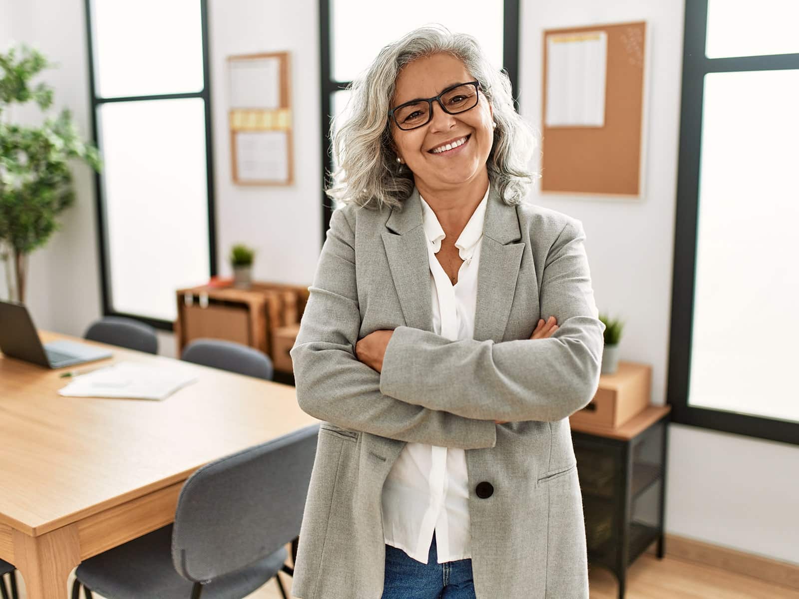 Mature woman smiling in office Mature woman smiling in office