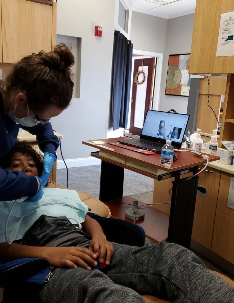 Dentist preforming a dental checkup